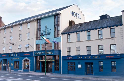 
a building with a sign on the side of it at Dooley's Hotel in Waterford
