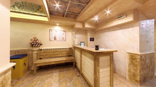 a room with a bar in the middle of a room at Balneo & SPA Hotel Aura in Velingrad