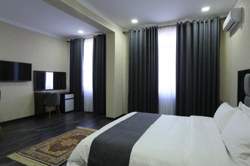 Postel nebo postele na pokoji v ubytování Hotel 777