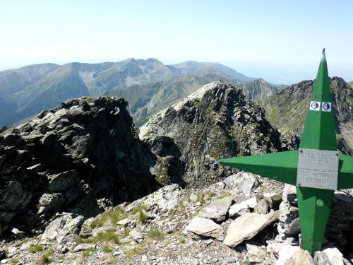 a green fighter jet sitting on top of a mountain at Cabana Dara in Cumpăna