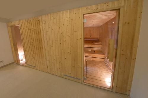 a room with a closet with wooden walls at Hotel Rekic in Bihać