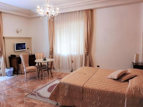 Postel nebo postele na pokoji v ubytování Regina di Saba - Hotel Villa per ricevimenti