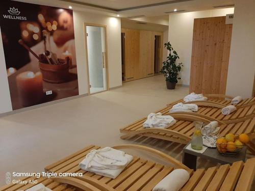 two beds in a hotel room with towels on them at Hotel Rekic in Bihać