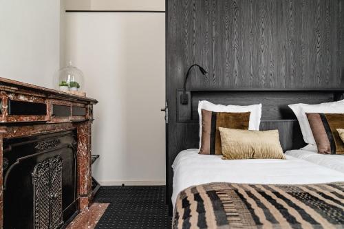 Ein Bett oder Betten in einem Zimmer der Unterkunft Hotel Monasterium PoortAckere Ghent