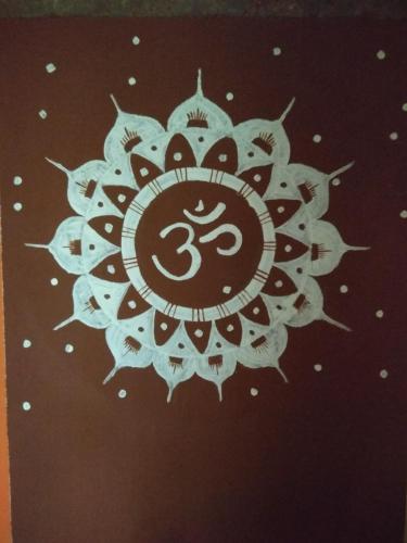 a drawing of a mandala on a wall at Dudhsagar Plantation in Cormonem