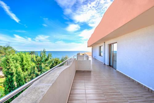 a balcony with a view of the ocean at Hotel Capri in Nesebar