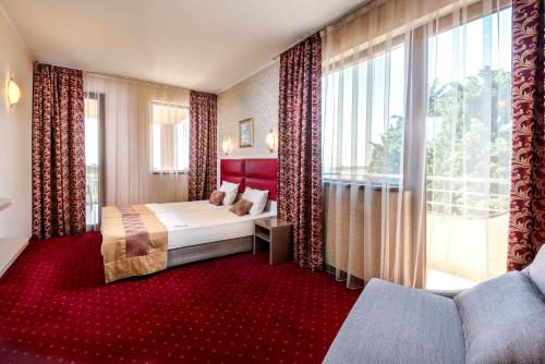 Postel nebo postele na pokoji v ubytování Hotel Capri