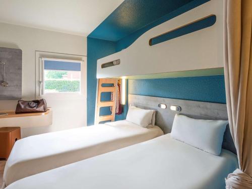 เตียงในห้องที่ Ibis budget Rouen Petit Quevilly