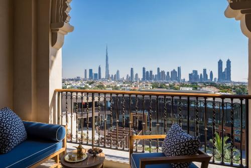 a balcony with a view of a city skyline at Four Seasons Resort Dubai at Jumeirah Beach in Dubai
