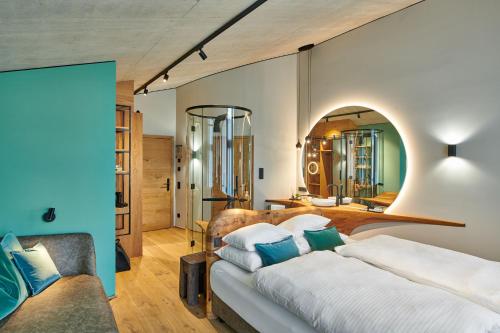 A bed or beds in a room at Boutique-Hotel LARTOR