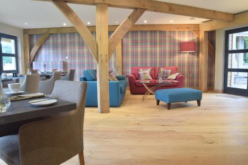 a living room with a table and chairs at The Loch Lomond Guesthouse in Balloch