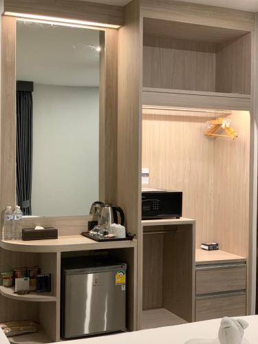 Orasa hotelにあるテレビまたはエンターテインメントセンター
