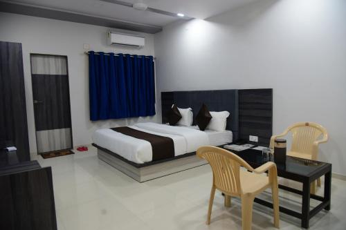 מיטה או מיטות בחדר ב-Hotel Savera Palace