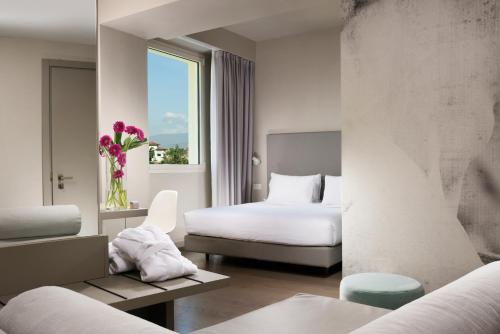 Tempat tidur dalam kamar di Hotel Glance In Florence