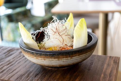 a bowl of food sitting on top of a table at Hotel Meridional in Guardamar del Segura