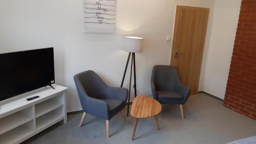 Three Apartmentにあるテレビまたはエンターテインメントセンター