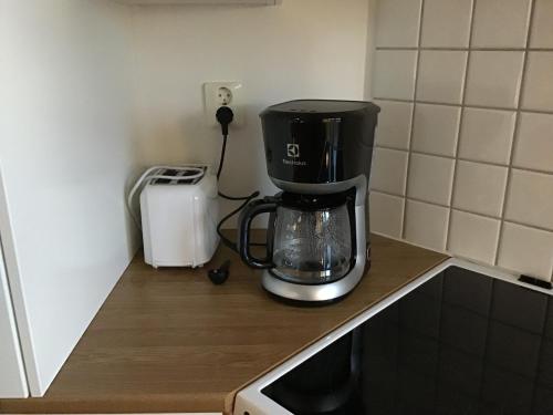a coffee maker sitting on top of a kitchen counter at Nordanå Gård in Strö