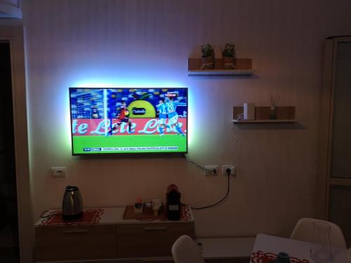 a flat screen tv hanging on a wall at Brutia Mom&Son in Cosenza