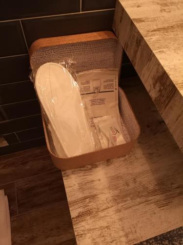 a box sitting on the floor in a bathroom at Brutia Mom&Son in Cosenza