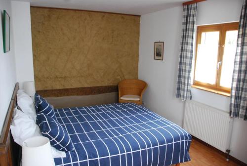 Un pat sau paturi într-o cameră la maisonbleue67