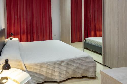 a hotel room with a bed and a mirror at Casa e Mare in Montignano