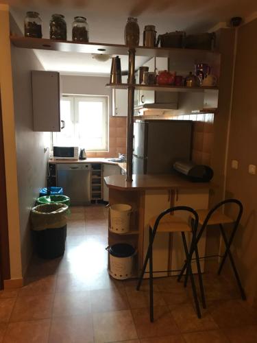 a kitchen with a table and two chairs in it at Agroturystyka Mętno 18 in Mętno