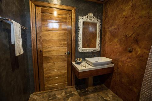 a bathroom with a sink and a mirror at Andalay Beach Resort Koh Libong in Ko Libong