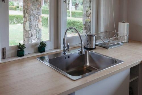 a stainless steel sink in a kitchen with a window at F5 3 Bed Rooms Beach house, full kitchen in Rayong