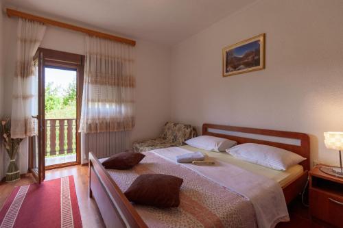 Postel nebo postele na pokoji v ubytování Plitvice House Milan