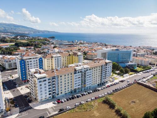 an aerial view of a city with buildings and cars at Apartment T3 in Downtown with Sea View in Ponta Delgada