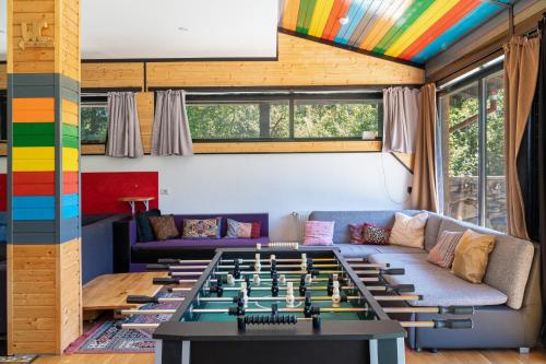 a living room with a large foosball table at Pensiunea ANA Vistisoara in Vistisoara
