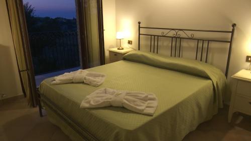 Tempat tidur dalam kamar di Residence Colle Veroni