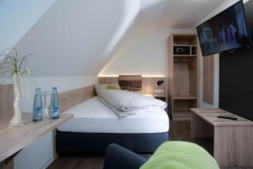 En eller flere senge i et værelse på Hotel Landgasthof Linde