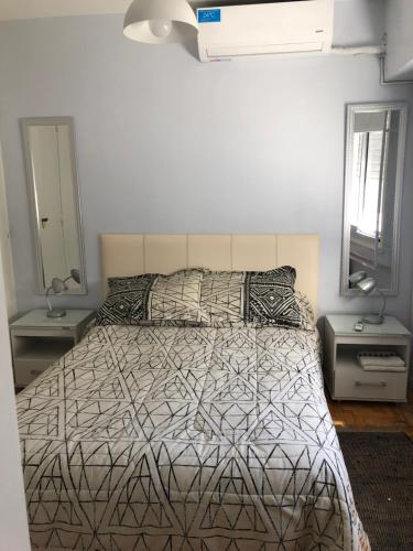 Llit o llits en una habitació de Ruffus's Apple Baires