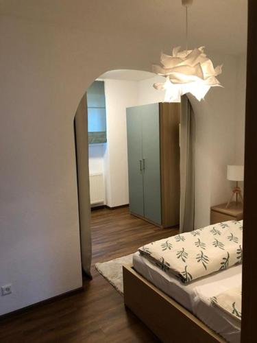 a bedroom with a bed and a large mirror at Ferienwohnung Stadtflair in Daun