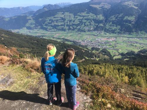 two girls standing on a hill overlooking a valley at Ferienwohnung Schweiberer in Fügen
