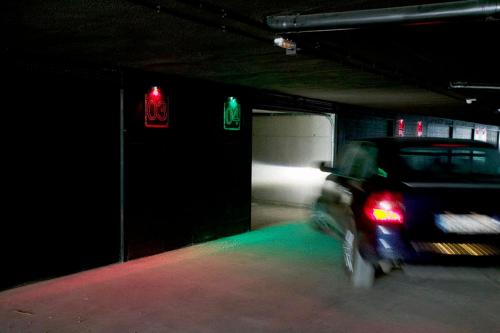 a car in a parking garage with a red light at Shhh in Onda