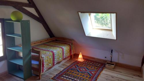 Tempat tidur dalam kamar di Gîte la Chamoussière