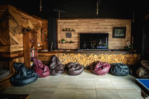 
a pile of luggage sitting on top of a wooden floor at Oshovia Hostel in Ushuaia
