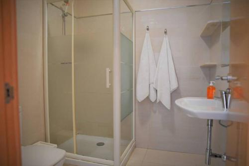 a bathroom with a shower and a toilet and a sink at Malaga-Vacation II in Málaga