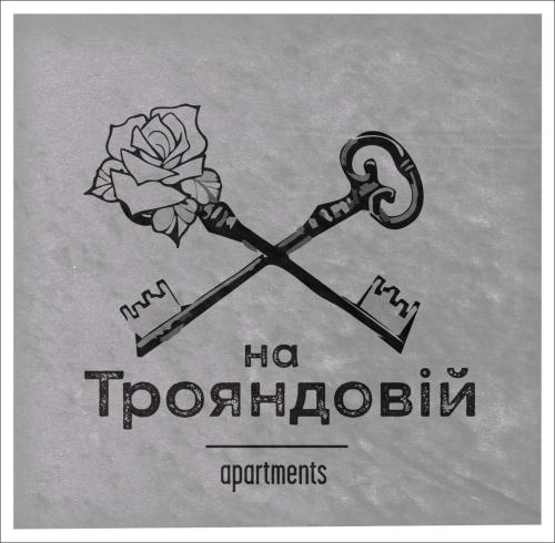 a drawing of a key with a flower on it at Apart Hotel на Трояндовой in Chernivtsi