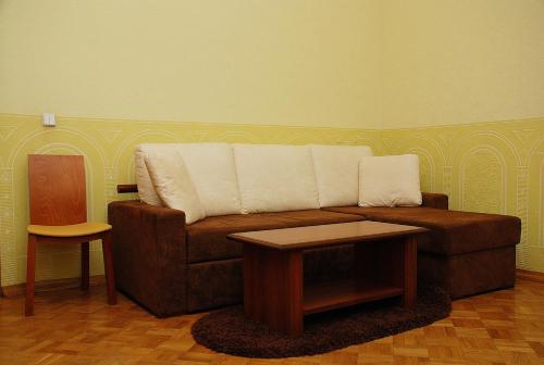 a living room with a couch and a table at Central Area Apartments in Kyiv