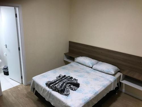 Кровать или кровати в номере Apartamento no Canto do Forte, Luxuoso e Confortável, 2 Suítes, Varanda Gourmet