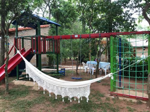 a playground with a hammock and a table at Los Lapachos in Altos