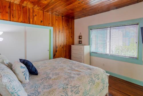 a bedroom with a bed and a window in it at Twins Inn & Apartments in St Pete Beach
