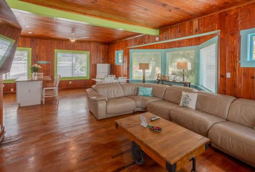 a living room with a couch and a table at Twins Inn & Apartments in St Pete Beach