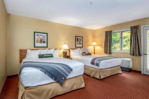 Een bed of bedden in een kamer bij Grand Summit Hotel