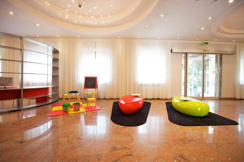
a living room filled with lots of furniture at Ibis Styles Parma Toscanini in Parma
