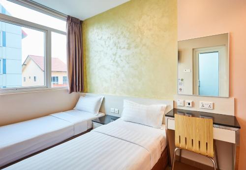 Postel nebo postele na pokoji v ubytování ibis budget Singapore West Coast