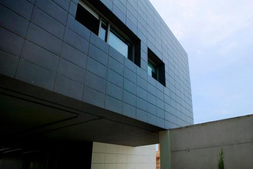 a building with windows on the side of it at Shhh in Onda
